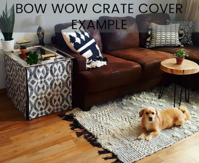 May include: A black and white patterned crate cover with the text "BOW WOW CRATE COVER EXAMPLE" on a brown leather couch with a small dog sitting on a white rug.