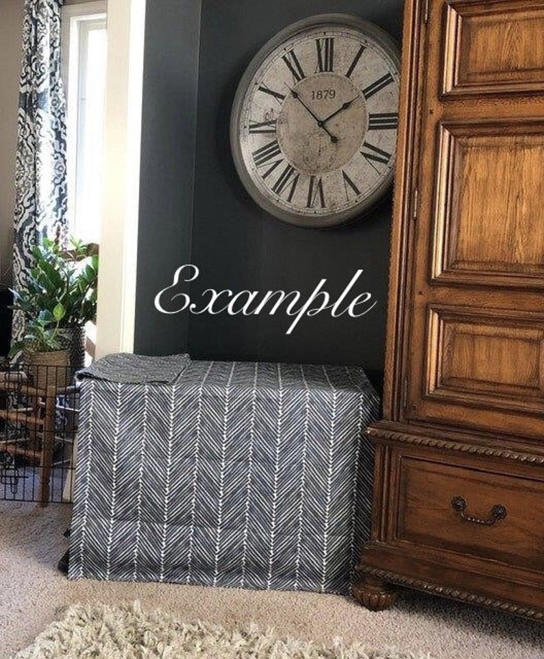 May include: A black and white chevron patterned table skirt with a large, antique-style clock with Roman numerals and the text "1879" on the face. The clock is hanging on a dark wall.