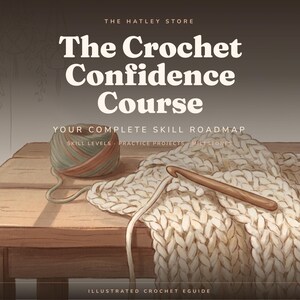 Peut inclure: Un guide de crochet illustré intitulé The Crochet Confidence Course, Your Complete Skill Roadmap, présentant une pelote de laine multicolore, un crochet en bois et un morceau de tissu crocheté crème posés sur une table en bois.