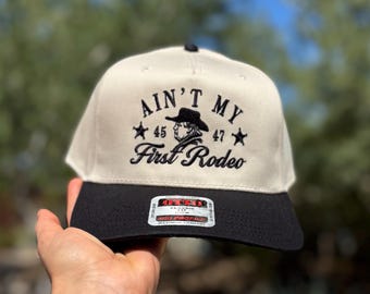 TRUMP Ain’t my First Rodeo, Cream/Black Trucker Hat, Embroidered Hat, Trendy Trucker Ha