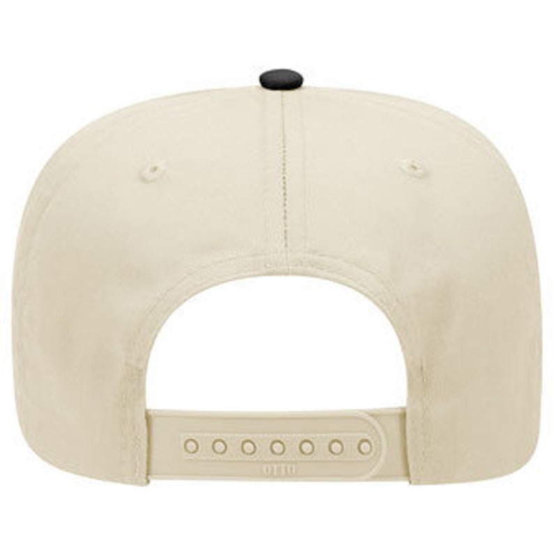 May include: A beige baseball cap with a black brim and a black adjustable strap with the text "U.F.C.O." printed on it.