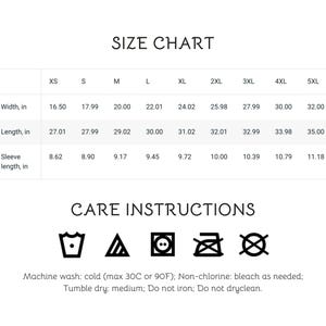 May include: A white size chart with measurements in inches for XS to 5XL. The chart includes width, length, and sleeve length. Below the chart are care instructions with washing symbols and text: Machine wash cold, non-chlorine bleach, tumble dry medium, do not iron, do not dry clean.
