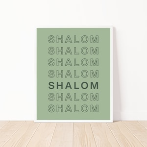 May include: A sage green printable wall art print with the word "Shalom" repeated seven times in a stacked, outlined font.