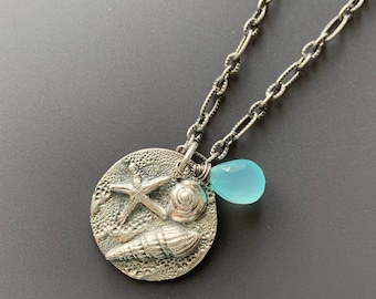 Sterling and Fine Silver Etched 18" Necklace with Round Seashell and Starfish Pendant and Caribbean Blue Chalcedony Teardrop