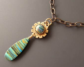 Hand Carved Bronze Flower Necklace with Rainbow Calsilica Cabochon and Rainbow Jasper Bead