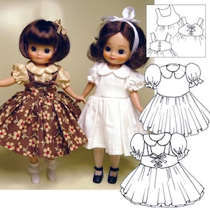 May include: Two dolls wearing dresses. One doll is wearing a white dress with a white collar and the other doll is wearing a brown and white floral dress with a white collar. Both dolls have brown hair and are wearing white socks and black shoes. A line drawing of a dress pattern is shown in the background.