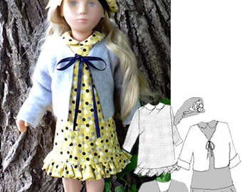 May include: A doll wearing a yellow and black polka dot dress with a ruffled hem, a gray cardigan with a black ribbon, and a yellow and black beret. The doll has blonde hair and blue eyes.
