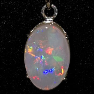 3.8 CT. Solid Natural Lightning Ridge Opal in ss Pendant.