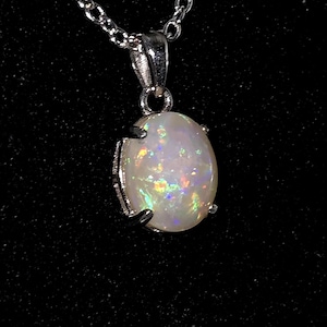 1.55 CT. Solid Coober Pedy Opal in ss Pendant.