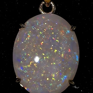 7.1 CT. Solid Natural Coober Pedy Opal in Gold Colored ss Pendant.