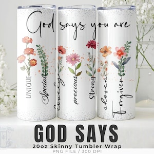 May include: Three white 20oz skinny tumbler wraps with floral designs and the words "God says you are." Each tumbler features different floral arrangements in shades of orange, pink, and purple, with accompanying words like "unique" and "chosen."
