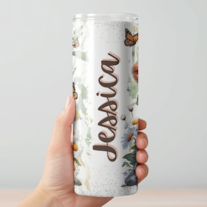 May include: A set of three ceramic mugs with a speckled, matte finish. The mugs are in shades of cream, light gray, and dark gray. Each mug has a simple, minimalist design, perfect for coffee or tea.