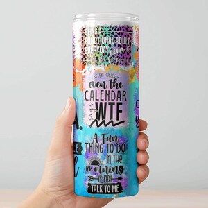 May include: A tall, cylindrical tumbler with a colorful design and humorous text. The tumbler features a mix of watercolor-style splashes in orange, purple, and blue. Text includes phrases like "Being a functional adult" and "WTF".