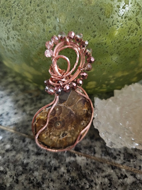 Ammonite Fossil wrapped in copper with bronze bead accents!
