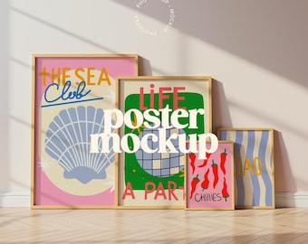 May include: A collection of framed posters with colorful designs. One poster features a seashell and the text "The Sea Club." Another displays a disco ball and the words "Life, A Part." Other posters show chili peppers and blue stripes.