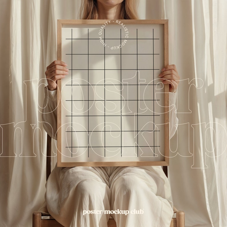 May include: A person holding a wooden frame with a white poster inside. The poster has a grid pattern on it. The text "HIGH QUALITY - REALISTIC MOCKUP" is printed on the frame.
