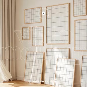May include: A collection of framed grid art prints in various sizes. The prints feature a white background with a black grid pattern, set within light wood frames. The arrangement includes prints leaning against a wall and hanging on the wall.