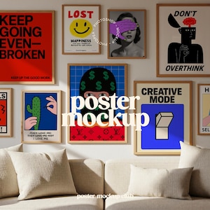 May include: A collection of framed art prints with various designs, including text-based and graphic illustrations. The prints feature bold colors like red, blue, and yellow, and are displayed above a beige sofa with matching pillows. The text "KEEP GOING EVEN-BROKEN" is visible.