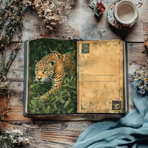 May include: An open vintage journal with a brown leather cover and blank pages. The left page features a colourful illustration of a jaguar in a jungle setting. The right page has a blank space for writing with a vintage stamp in the top right corner.