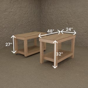 May include: Two light-colored wooden side tables. The tables are rectangular with a lower shelf and measure 48 inches long, 24 inches wide, and 32 inches high. One table is 27 inches high. The tables are on a neutral background.