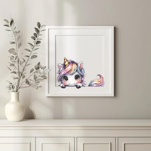 May include: A framed print featuring a whimsical unicorn illustration. The unicorn has a golden horn, colorful mane and tail, and large, expressive eyes. The artwork is set against a white background within a white frame, suitable for children's room decor.