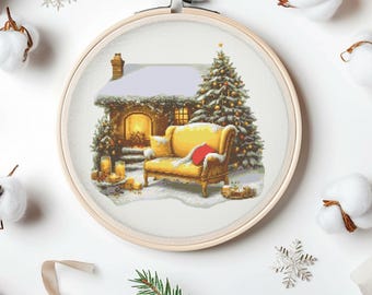 May include: A cross-stitch pattern of a cozy cottage with a lit window, a yellow couch, and a decorated Christmas tree in a snowy setting.