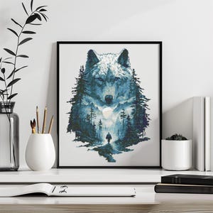 May include: Framed art print featuring a detailed illustration of a wolf's face, with a forest and a person walking on a path in the background. The artwork is primarily in shades of blue and white, creating a serene and natural scene.