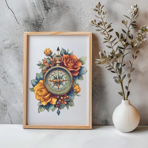 Puede incluir: Impresión enmarcada con un diseño de brújula vintage, rodeada de rosas de acuarela naranja, amarilla y azul. La brújula tiene una esfera detallada. El marco de madera añade un toque rústico. Fondo blanco.