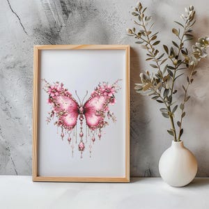 May include: A framed print of a pink butterfly with floral details and dangling crystals. The butterfly is surrounded by a white background.