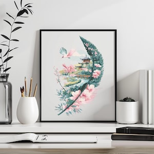 Puede incluir: Una impresión enmarcada de una ilustración estilizada de una pluma con un diseño floral rosa y verde. La pluma está llena de una escena de un jardín japonés tradicional con una pagoda y un pequeño arroyo.