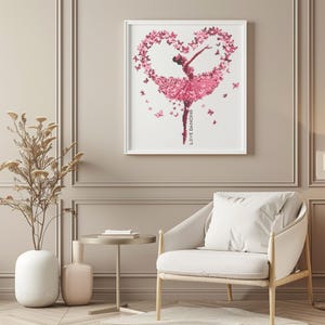 May include: A framed print of a ballerina dancing in a pink tutu with butterflies forming a heart shape around her. The text "LOVE DANCING" is written vertically on the right side of the print.
