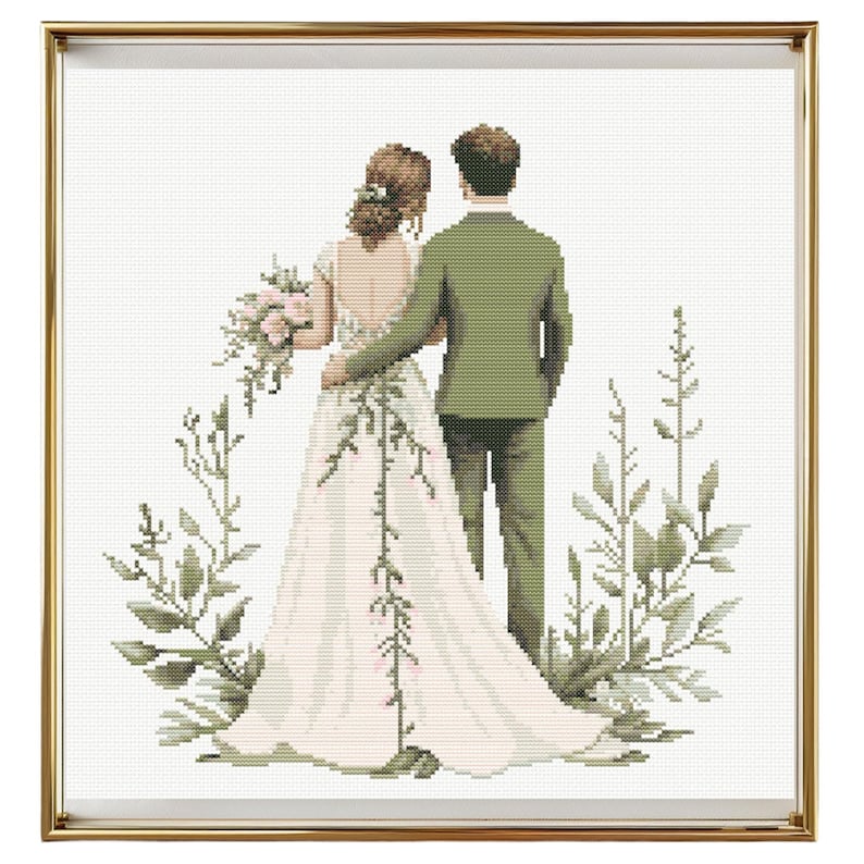 May include: A bride and groom stand back to back, facing away from the viewer. The bride is wearing a white wedding dress with a long train. The groom is wearing a green suit. They are surrounded by green foliage.
