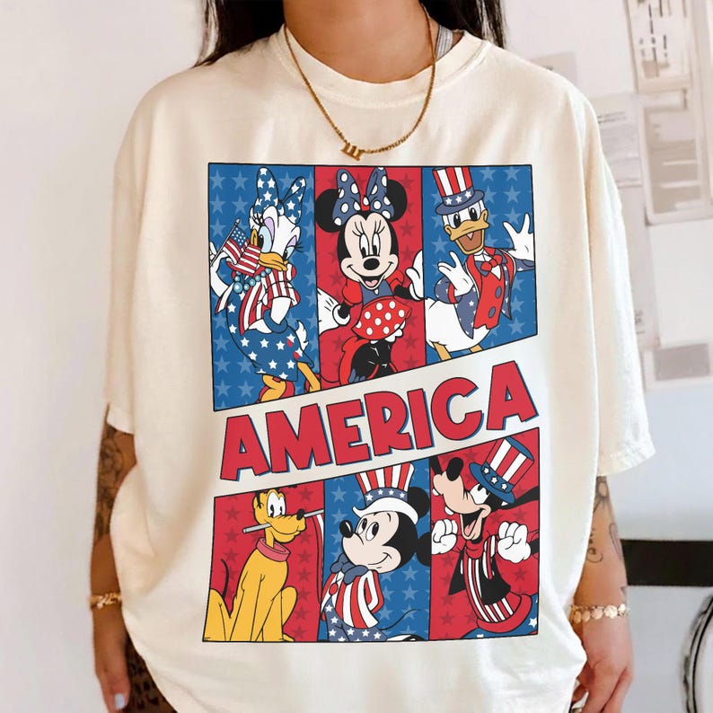 May include: A set of three ceramic mugs with a speckled, cream-colored glaze. Each mug features a different hand-painted design: a blue and green leaf, a yellow flower, and a red berry. The mugs have a simple, modern design.