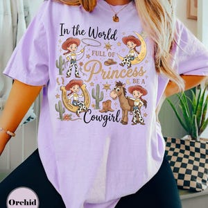 Toy Story Jessie And Bullseye Shirt, In a World Full of Princesses Be a Cowgirl Tee, Pixar Movie Fan Gift, Disney Western Cowgirl Outfits Orchid (Comfort)