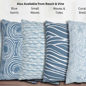 May include: A collection of decorative throw pillows in various blue and white patterns. Designs include watercolor stripes, swirls, small waves, larger waves, and coral and shells. The text "Also Available from Beach & Vine" is visible.