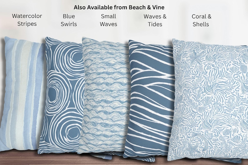 May include: A collection of decorative throw pillows in various blue and white patterns. Designs include watercolor stripes, swirls, small waves, larger waves, and coral and shells. The text "Also Available from Beach & Vine" is visible.