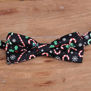 Boys Christmas candy cane and holly bow tie on black cotton - kids holiday bowtie - infant baby toddler child preteen, black red green