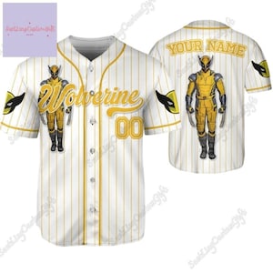 May include: White baseball jersey with yellow stripes and a yellow Wolverine graphic. The jersey has a button-up front and short sleeves. The back of the jersey has the text "YOUR NAME" in yellow.