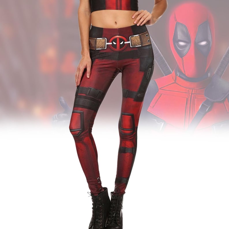 May include: Red and black leggings with a Deadpool character design. The leggings have a belt with a Deadpool logo and a black and red pattern.