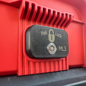 May include: Close-up of a black lock with a keyhole and the text "Pak Lock ML3" on a red toolbox.