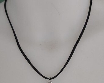 Black choker necklace with its silver metal scorpion