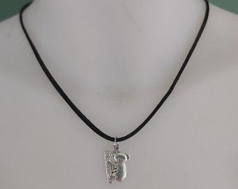 Black choker necklace with its silver metal koala