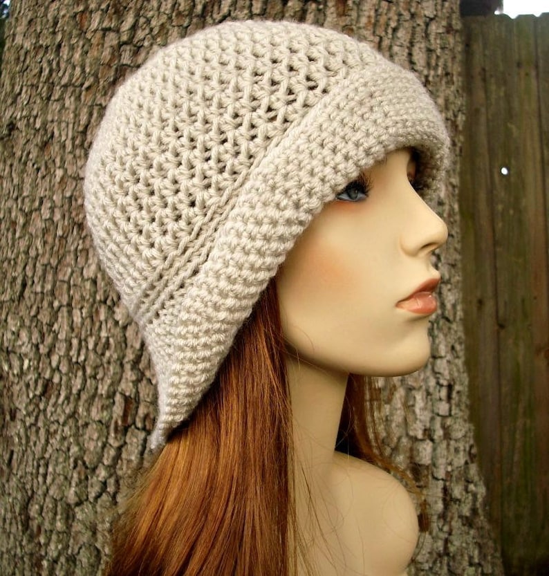 A soft beige crochet bucket hat. This hat fits an average adult and teen head size of 20 to 23 inches.