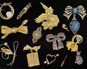 Collection of various vintage style brooches - Uniquely designed gold and silver jewelry - Exquisite fashion accessories collection