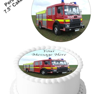 May include: A 7.5 inch round edible cake topper featuring a red fire truck with the words "Your Message Here" on a blue background.