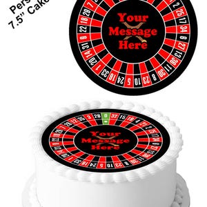 May include: A 7.5 inch round edible cake topper featuring a roulette wheel design. The wheel is red and black with white numbers. The center of the wheel has a black background with the text "Your Message Here" in red.