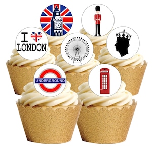 Op de afbeelding: Cupcakes met witte frosting en gouden cupcake wrappers. Elke cupcake is bekroond met een cirkelvormige afbeelding met Londense iconen: Big Ben, de London Eye, een Beefeater-wacht, een silhouet van een gekroond hoofd, een rode telefooncel en het Underground-logo.