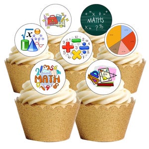 May include: Six cupcakes with white frosting and gold cupcake liners. Each cupcake is decorated with a circular image featuring math symbols, equations, and the word "MATHS". The images include a pie chart, a calculator, and a square root symbol.