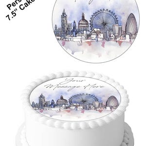 Op de afbeelding: Een witte taart met een taarttopper van 19 cm met een skyline van Londen. De topper bevat de Big Ben, de London Eye en andere bezienswaardigheden. De woorden "Your Message Here" staan op de topper.
