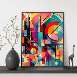 Op de afbeelding: Abstracte kunstprint met een zwarte lijst. Het kunstwerk toont een levendig geometrisch ontwerp met vormen in rood, oranje, geel, blauw en paars. De compositie bevat cirkels, lijnen en rechthoekige vormen, wat een dynamisch en kleurrijk beeld creëert.